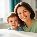 Kyiv parent smiling beside a child in a bright apartment with a phone on the table