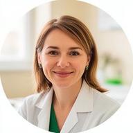 Kyiv clinic director speaking beside a bright consultation room window