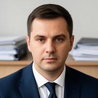 Legal counsel reviewing documents in a Kyiv office with soft daylight